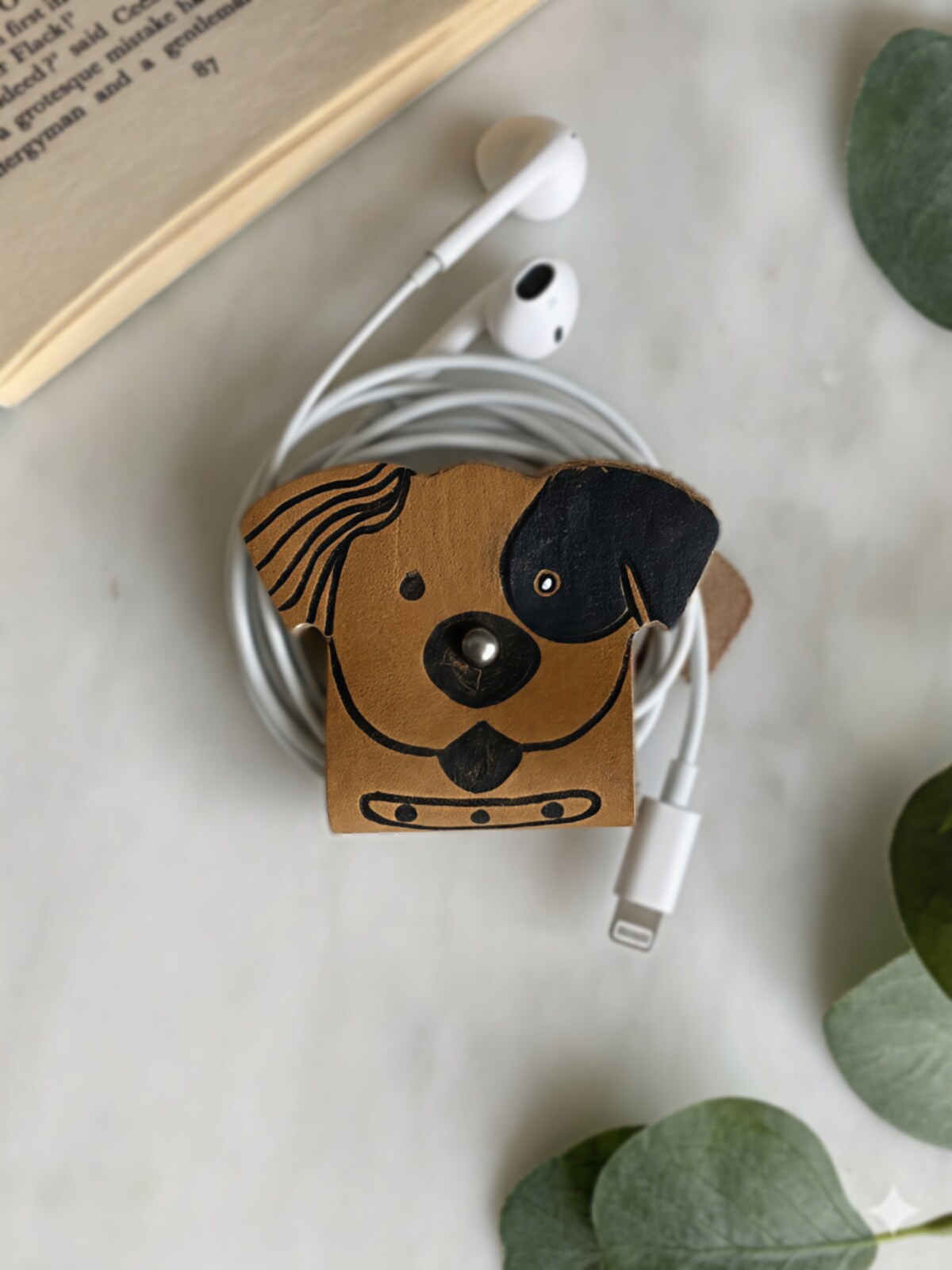 Group of handcrafted leather and engraved gifts