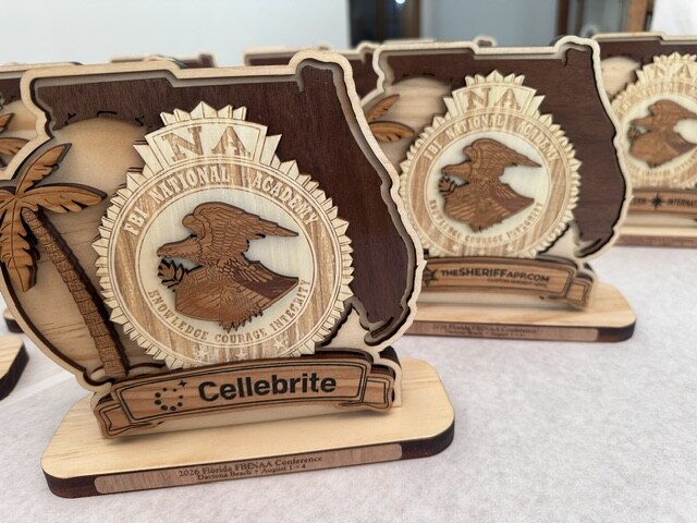 Layered wooden sponsor plaques displayed together